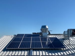 rooftop solar panels against blue sky in sydney
