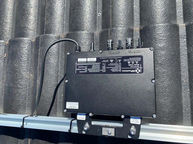 APsystems microinverter on a rooftop black colour