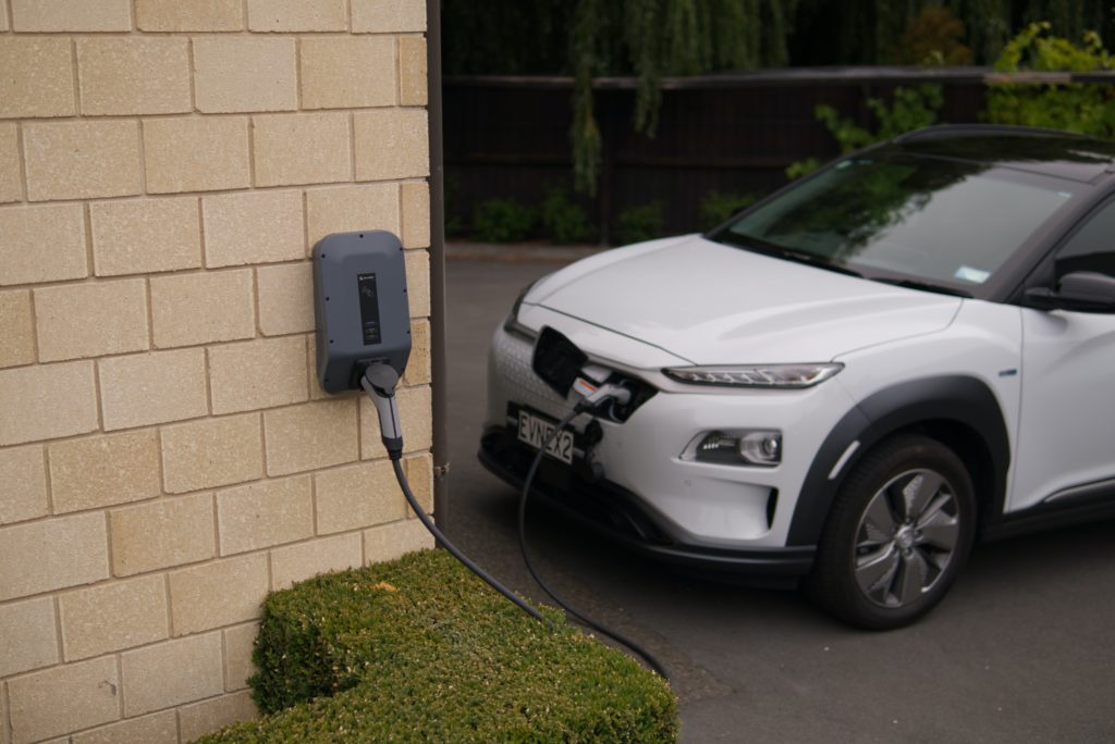 white electric vehicle charging at home